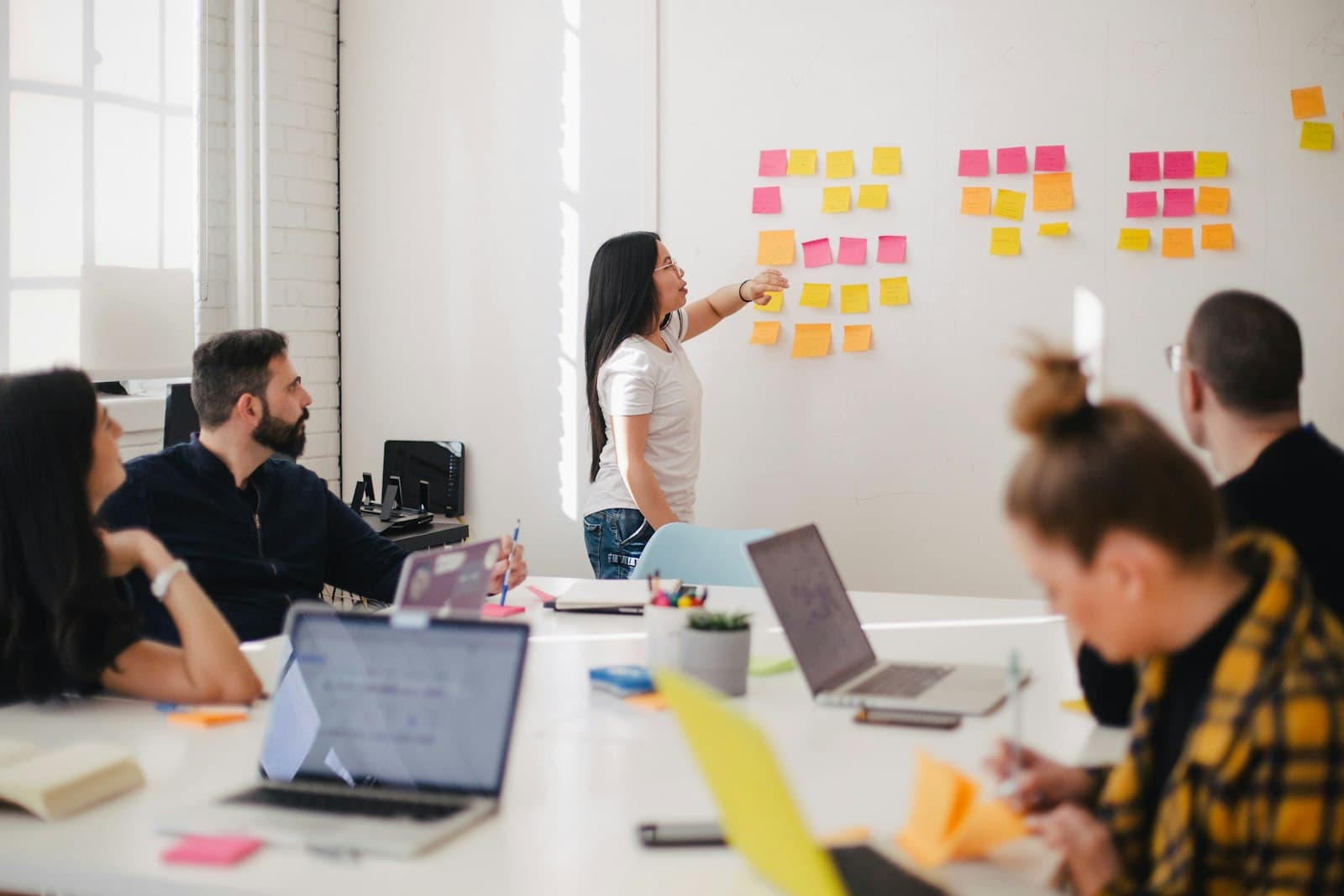 Team members reviewing product research together around a table